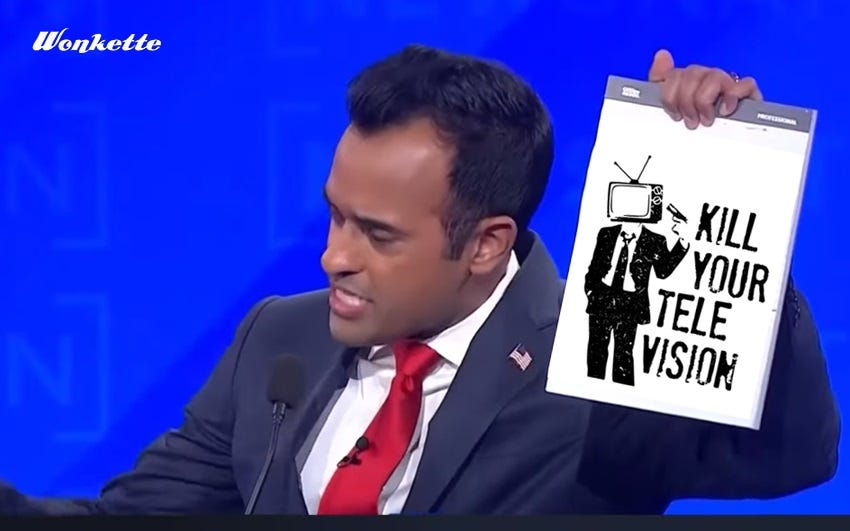 Screenshot from 4th GOP debate of Vivek Ramaswamy holding up a pad of paper, photoshopped with a 'Kill your Television' stencil by Banksy