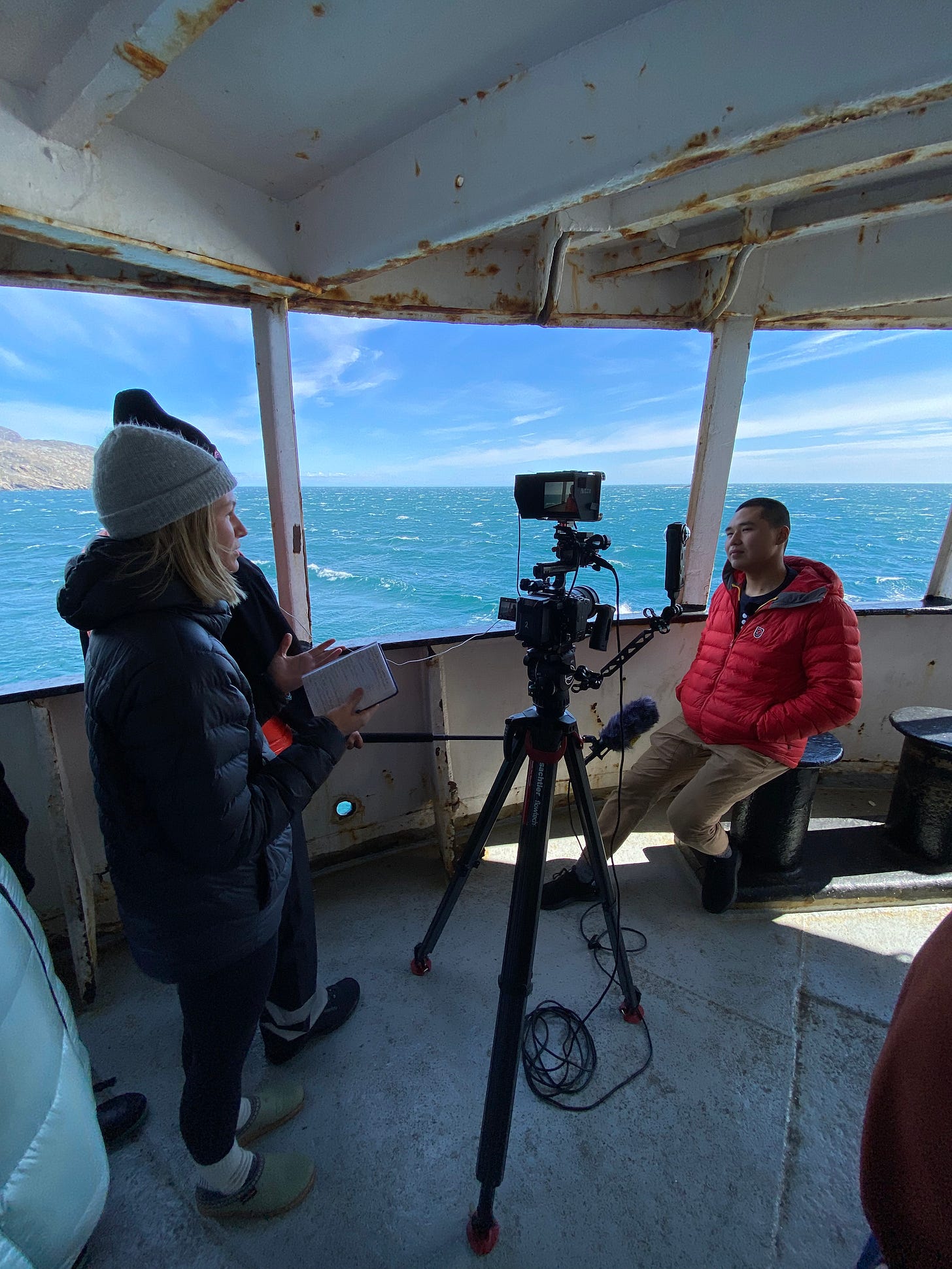 An on camera interview taking place on the ship.