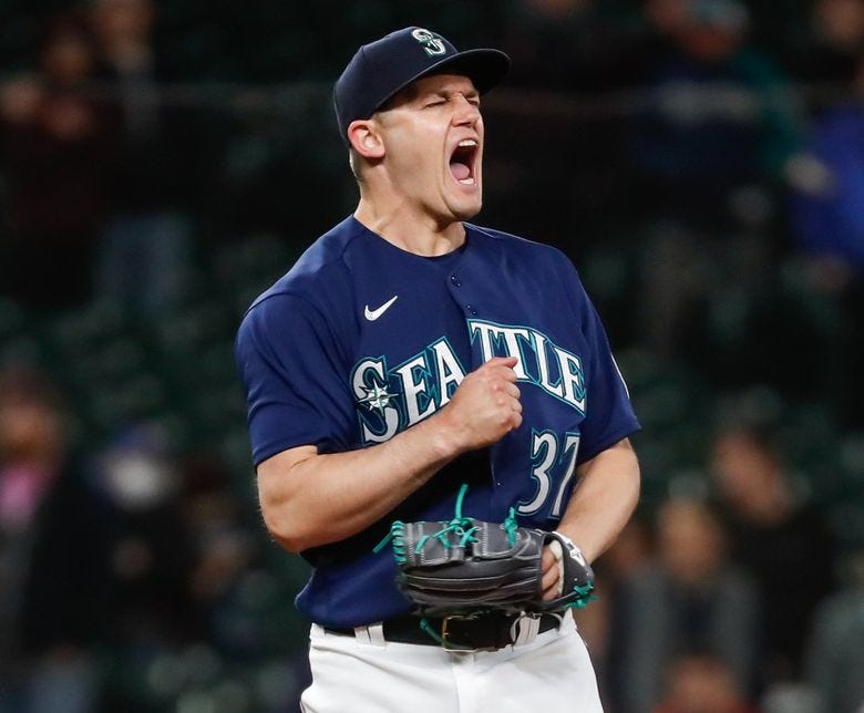 Mariners reliever Paul Sewald celebrates after getting the last out in the ninth inning against the Philadelphia Phillies Tuesday. (Jennifer Buchanan / The Seattle Times)