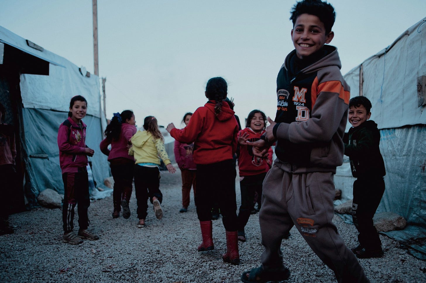 On the periphery of Shtoura in the Bekaa, a Syrian camp at dusk - Photographer: Rachel Cisinski (February 2023)
