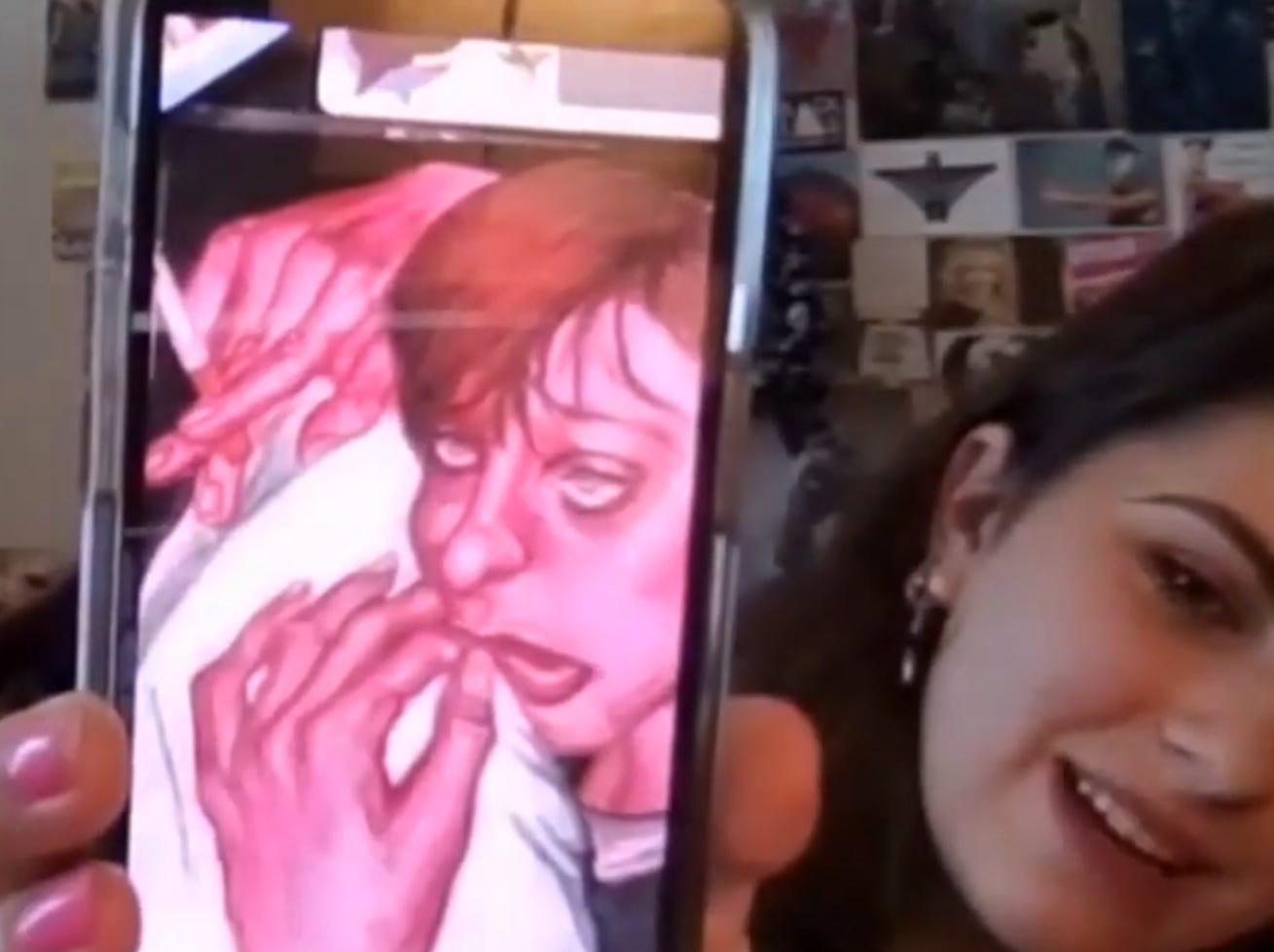 Screenshot of Bella holding a phone with a drawing of a young, inebriated-looking woman leaning on a cushion and holding a cigarette