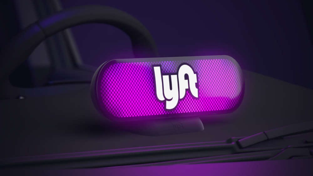 The Lyft logo on a car sign