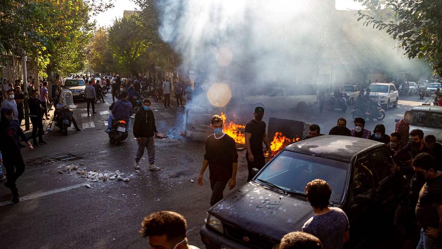 Iranians protest the death of Mahsa Amini after she was detained by the morality police last month, in Tehran, on October 27. 