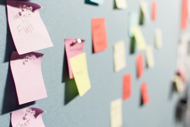 Photo of post it notes on a memo board