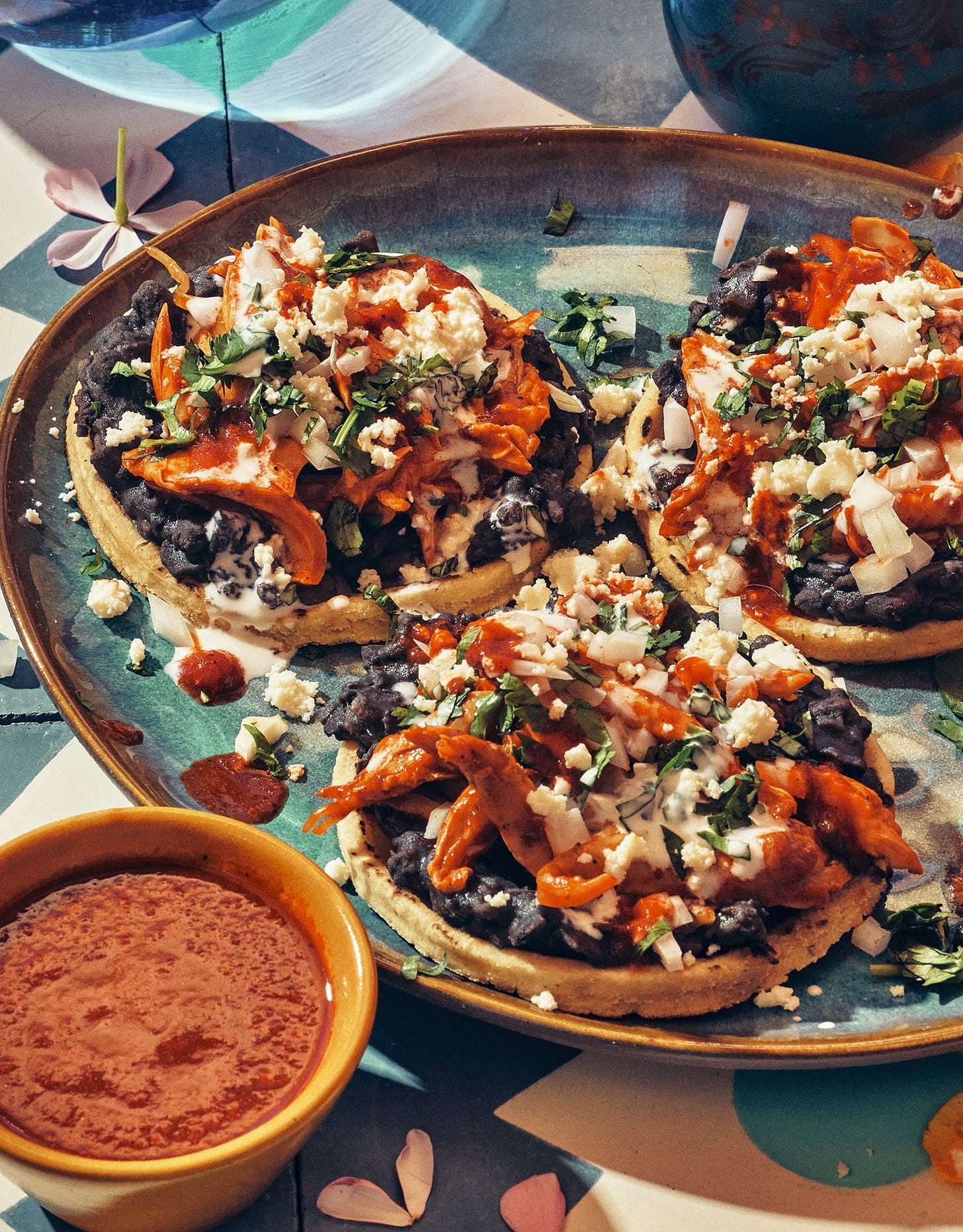 3 tostadas on a plate.