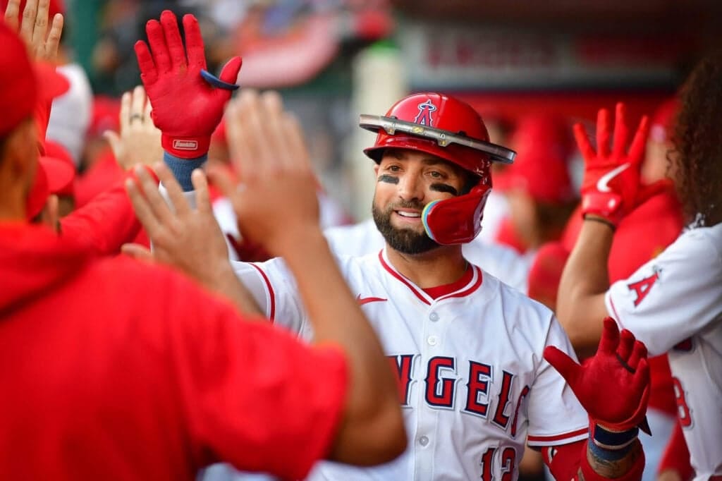 May 28, 2024; Anaheim, California, USA; Los Angeles Angels center fielder Kevin Pillar (12) is greeted after hitting a two run home run against the New York Yankees during the first inning  at Angel Stadium. Mandatory Credit: Gary A. Vasquez-USA TODAY Sports
