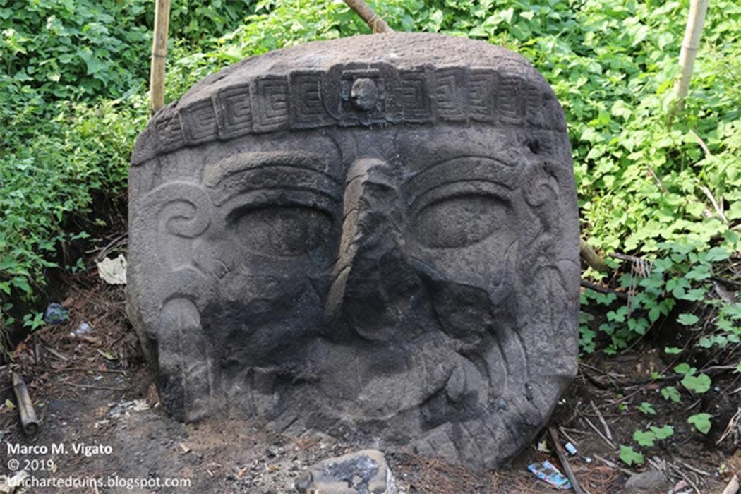 A view of the same colossal stone head still partially buried in the ground. It is the portrait of a bearded individual, of a race different from that of the present Maya population, with a long aquiline nose and slanting eyes. Could this be the portrait of an old-world visitor, perhaps a Phoenician navigator? (Image: © Marco Vigato)