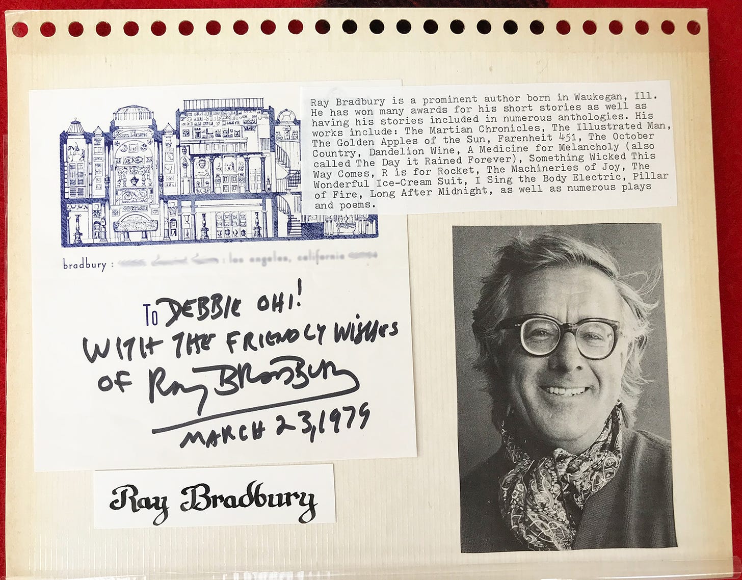 The image is a scrapbook-style page featuring a black and white photograph of Ray Bradbury, an American author known for his works in science fiction and fantasy. To the left of the photo is a typed note briefly summarizing Bradbury's accomplishments, mentioning some of his famous works like Fahrenheit 451 and The Martian Chronicles. Below the note is a handwritten inscription that reads, "To Debbie Ohi! With the friendly wishes of Ray Bradbury, March 23, 1979." The page also includes a small sketch of a building and Ray Bradbury's name in a decorative font at the bottom.