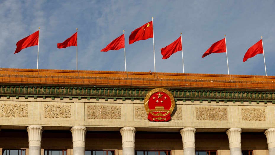 FILE PHOTO: A Chinese flag flutters on top of the Great Hall of the People ahead of the opening ceremony of the Belt and Road Forum (BRF), to mark 10th anniversary of the Belt and Road Initiative, in Beijing, China October 18, 2023. REUTERS/Edgar Su/File Photo