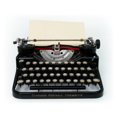 A typewriter with a piece of paper

Description automatically generated with medium confidence