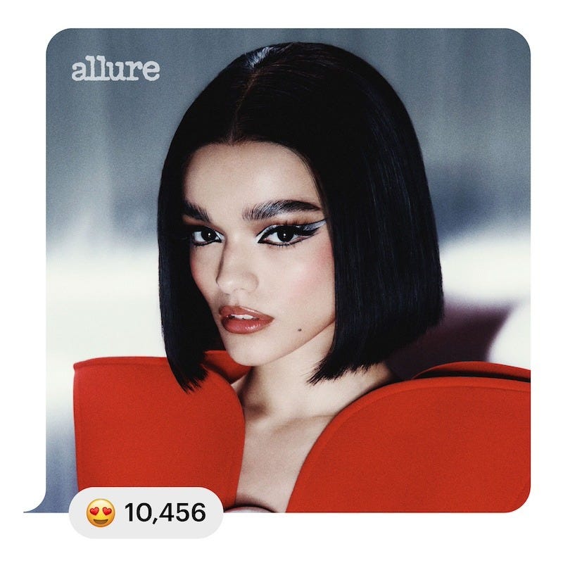 rachel zegler poses for the cover of allure in silver eye makeup and a black bob haircut