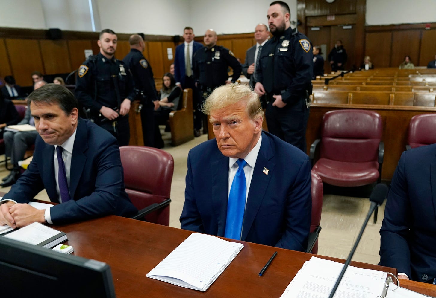 Former President Donald Trump awaits the start of proceedings during jury selection at Manhattan criminal court.