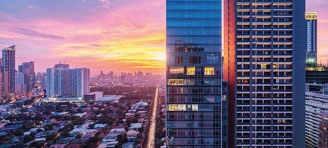 southeast asia building skyline with colorful sunset