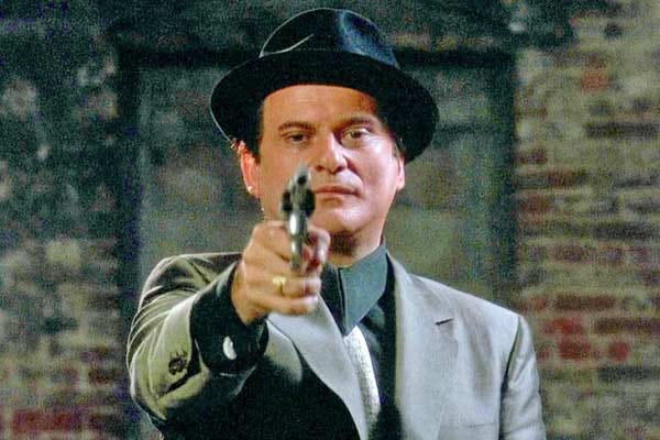 Joe Pesci pointing pistol at camera from the film Goodfellas