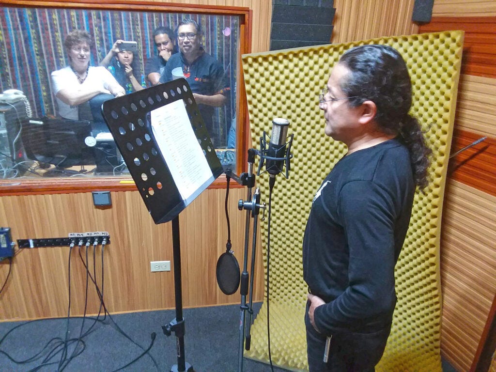 Observing a live recording of the radionovela Toma Mi Mano (Take My Hand) from the booth with the production team, Guatemala Observing a live recording of the radionovela Toma Mi Mano (Take My Hand) from the booth with the production team, Guatemala