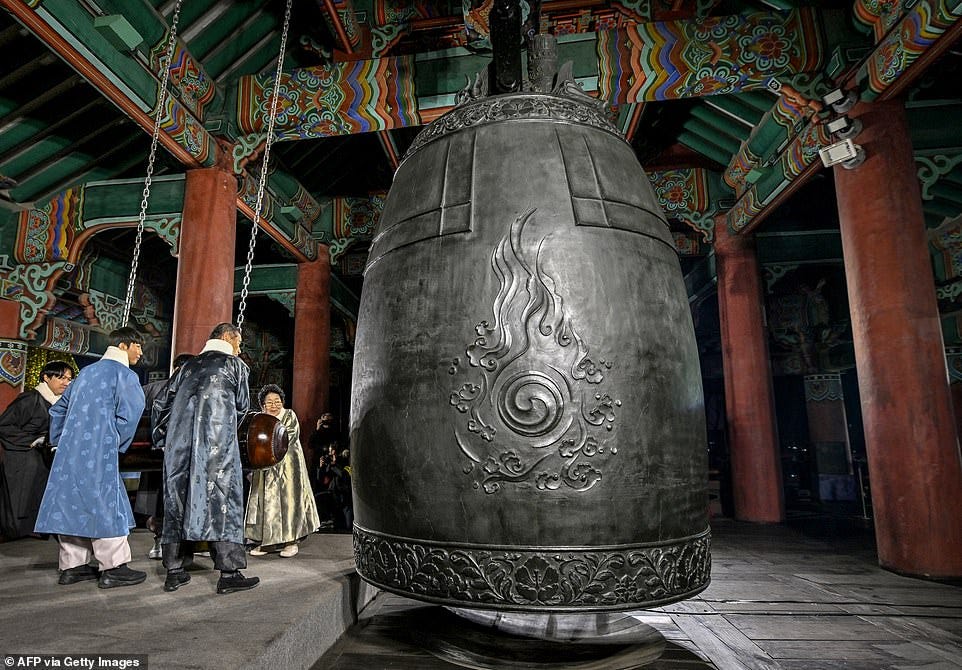 SEOUL: Participants hit a huge bell to welcome the 2025 New Year's Day, during celebrations post midnight at the Bosingak pavilion in central Seoul on January 1, 2025