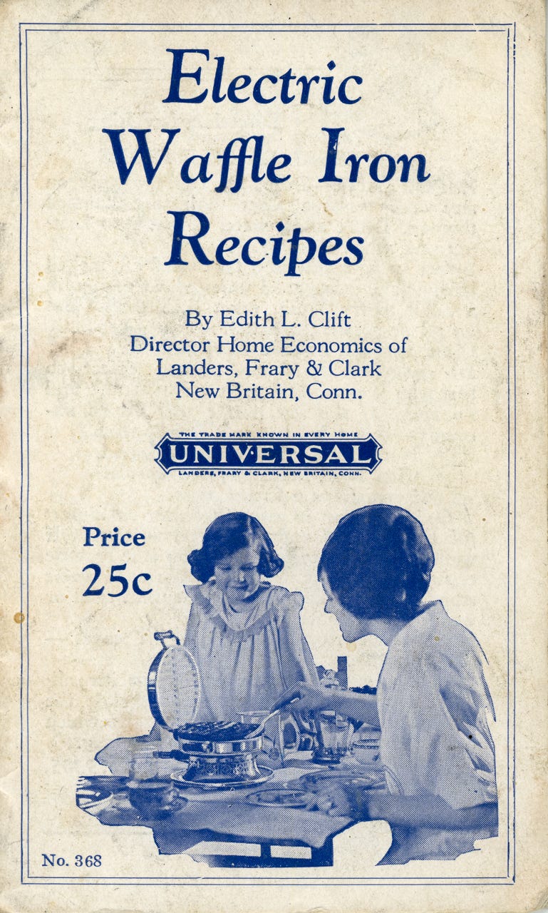 The cover of a pamphlet titled "Electric Waffle Iron Recipes" includes text about the book and a picture of a young girl looking on as a woman cooks a waffle on a small waffle maker.