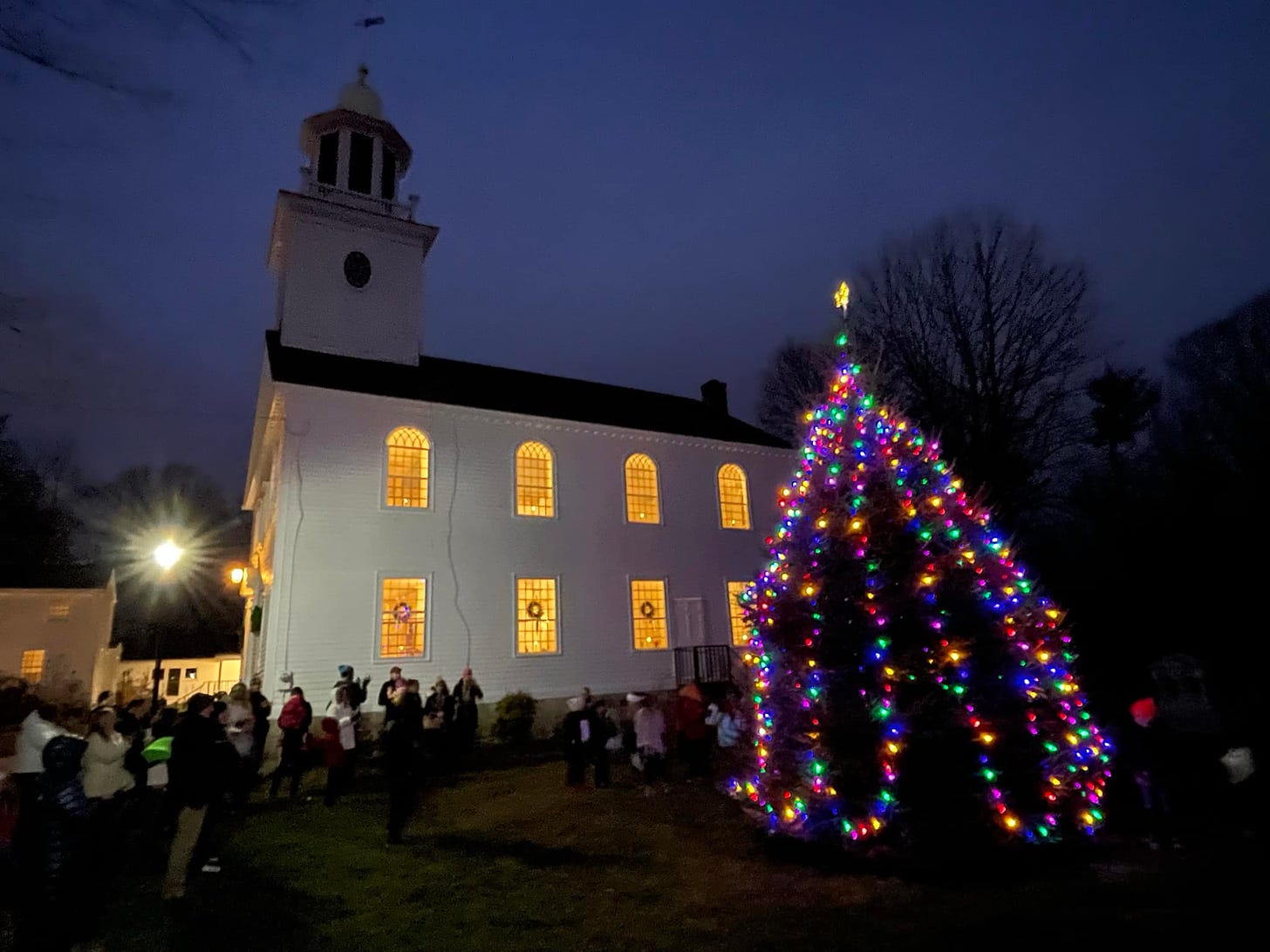 May be an image of 8 people and christmas tree