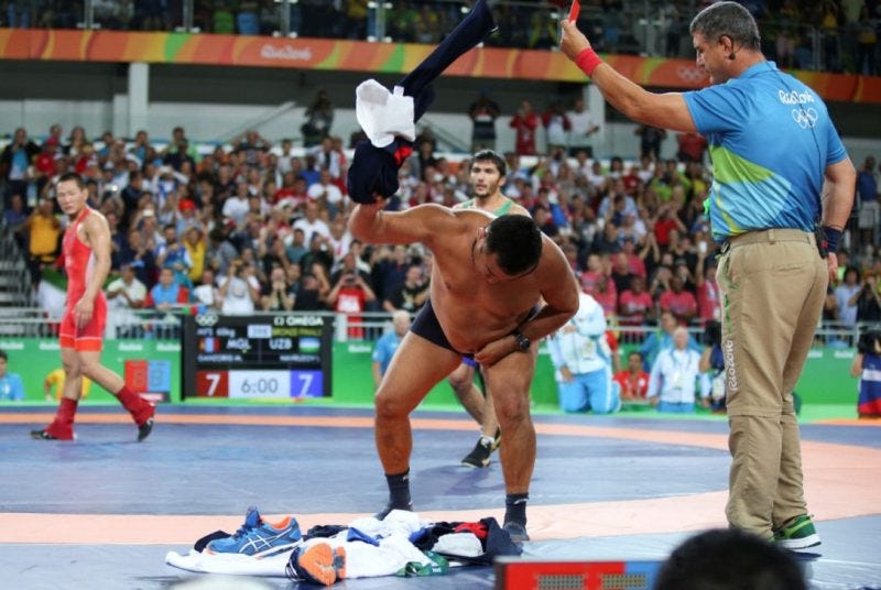 mongolian coaches strip to protest rio olympics