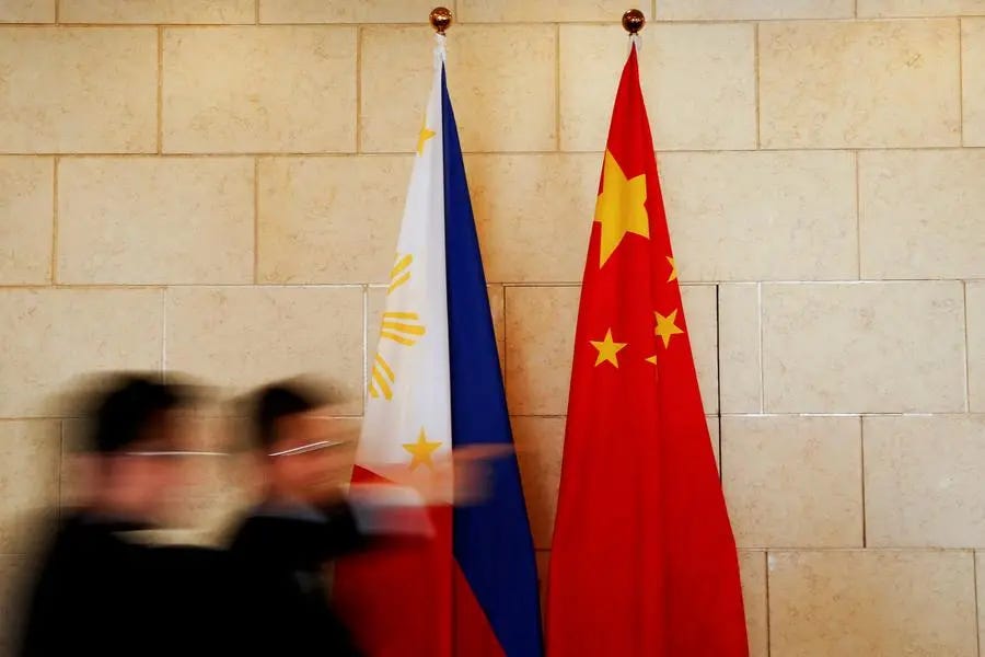 FILE PHOTO: National flags are placed outside a room where Philippine Finance Secretary Carlos Dominguez and China\\'s Commerce Minister Gao Hucheng address reporters after their meeting in Beijing, China, January 23, 2017. REUTERS/Damir Sagolj/File Photo Image used for illustrative purpose. , Reuters