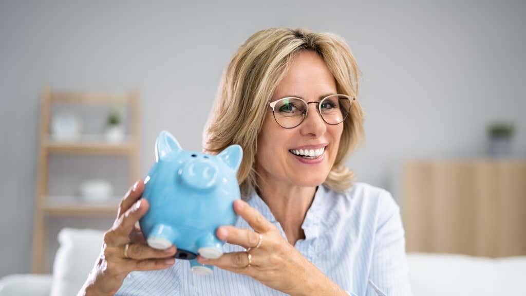 A woman with a piggy bank