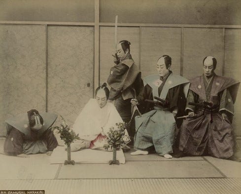 Japanese samurai reenacting seppuku.