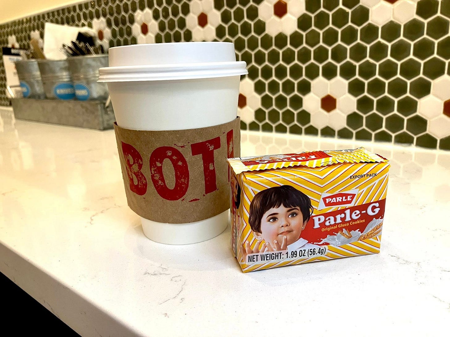 May be an image of 1 person, oatmeal cookies, cornflower and text that says 'XPOBrPACK EXPOR PARLE PARLE Parle-G luce Parle- G Cookles Original rigina Gluco NET WEIGHT: NETWEIGHT:1.990Z 1.99 0Z(56.4g)'