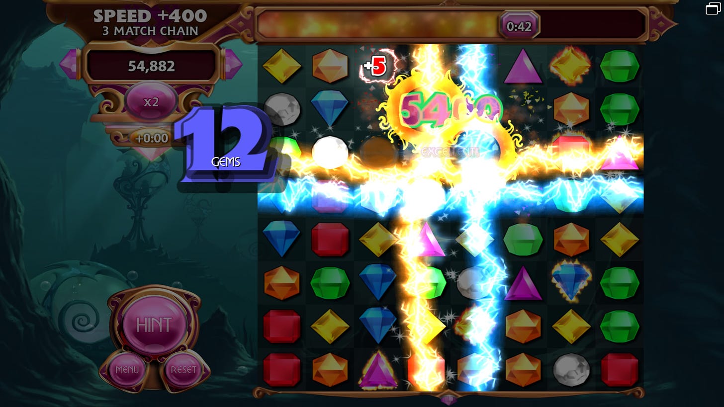 Screenshot of Bejeweled 3 lightning mode. Two star gems are being detonated, forming two sets of perpendicular lightning strikes.