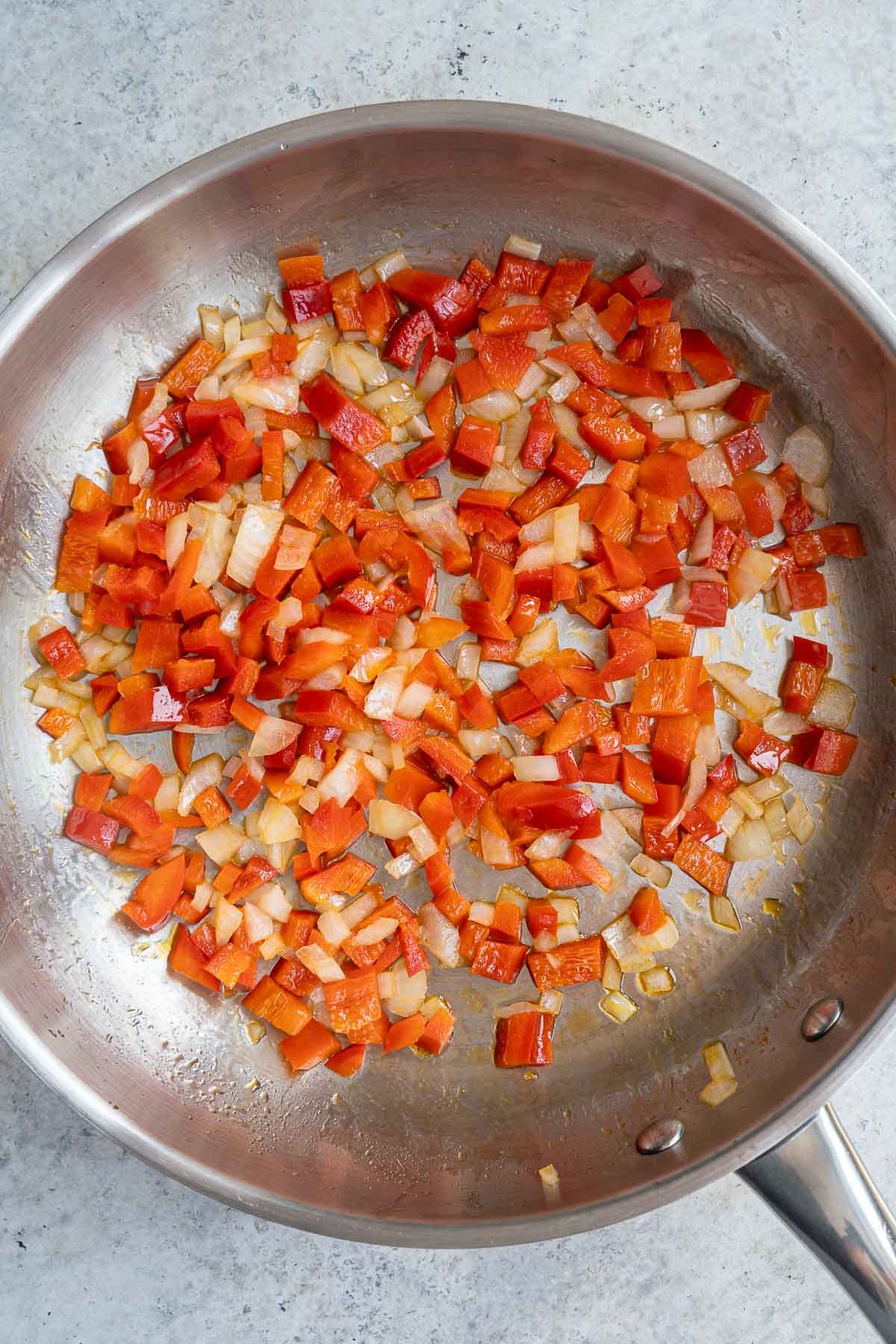 Stir frying onion and red pepper