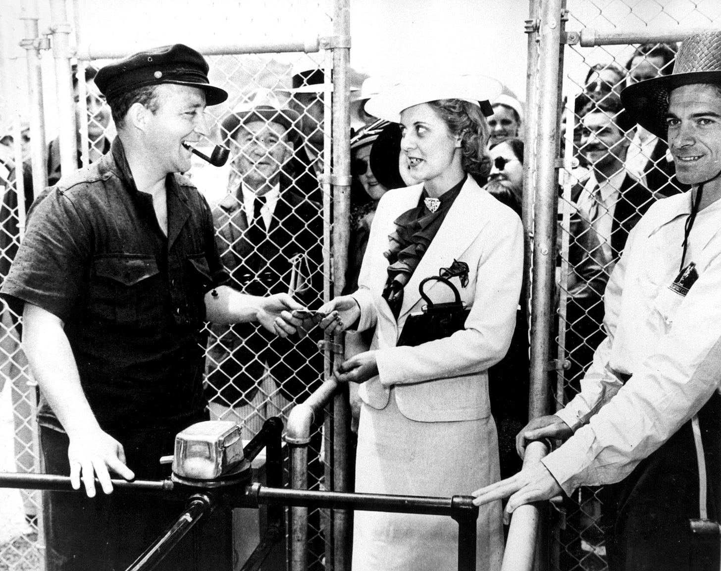 Bing Crosby taking tickets and greeting guests on opening day at Del Mar on in 1937