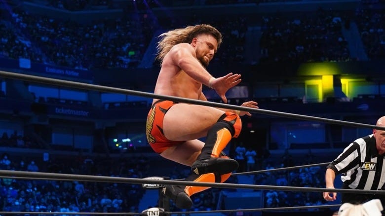 Brian Pillman Jr., either attempting a dropkick, or surfing the air