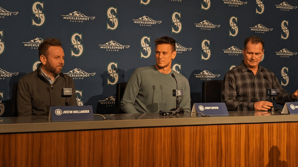 From left to right, Mariners General Manager Justin Hollander, President of Baseball Operations Jerry Dipoto and Manager Scott Servais answer questions from reporters at the season wrap-up press conference October 3, 2023 (Niko Tamurian)