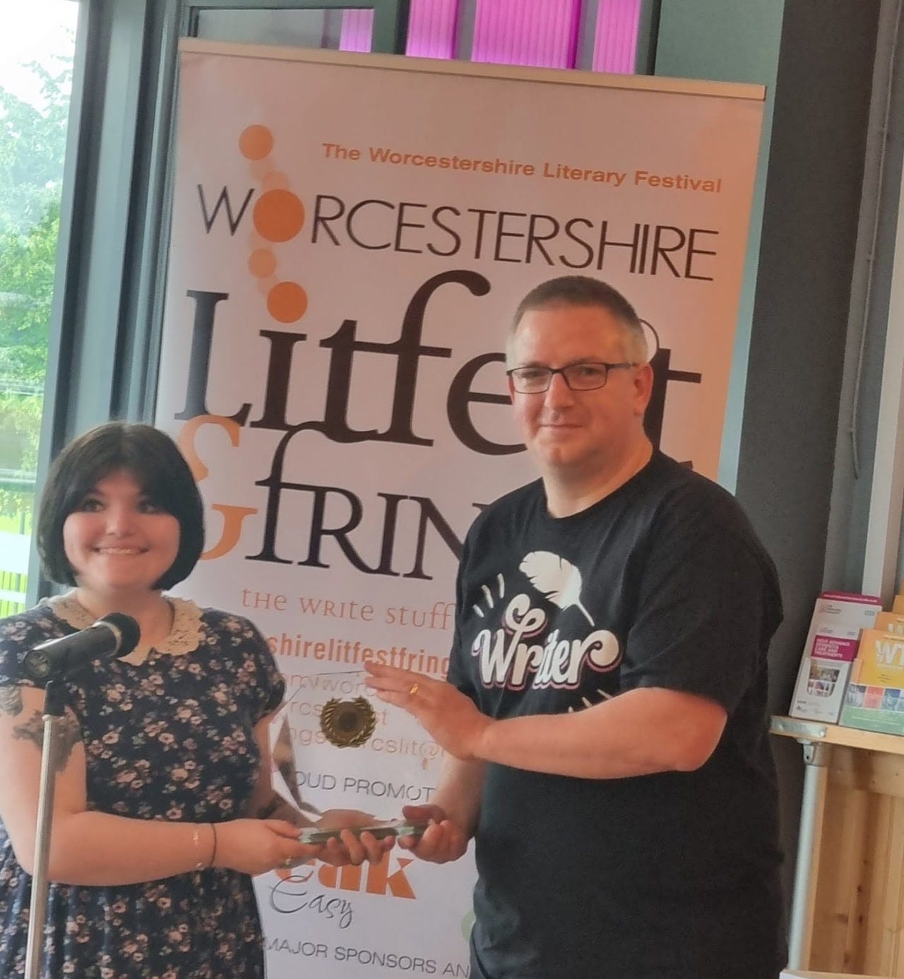 Damon Lord, receiving his trophy from the previous year’s Worcestershire Poet Laureate, Rhianna Levi.