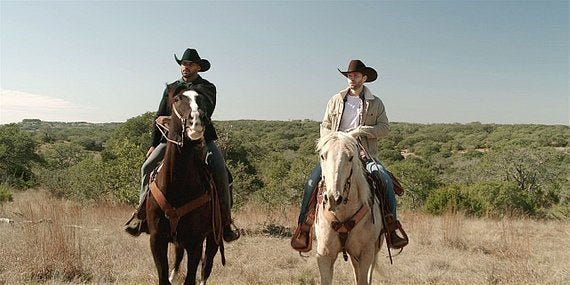 Gay Liam and Trey on horseback looking at ranch on Walker.