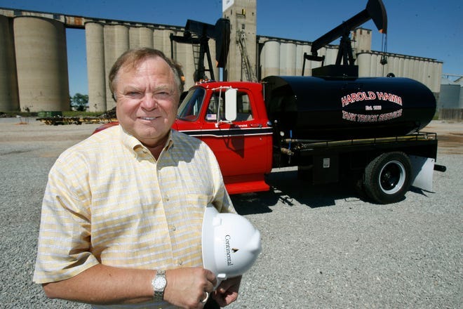 Harold Hamm, chairman and chief executive officer (CEO) of Continental Resources, shows the original truck with which he started one of his oil company businesses.  Hamm told an energy conference in Oklahoma City Monday his industry isn't going away any time soon.
