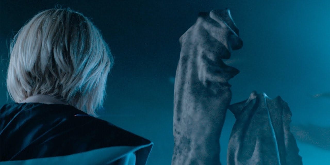 This image shows the Thirteenth Doctor (played by Jodie Whittaker), with her back to camera, confronting one member of the extraterrestrial Remnant species, which resembles a large cloth bandage or strip at least as large as a person. This image shows the Thirteenth Doctor (played by Jodie Whittaker), with her back to camera, confronting one member of the extraterrestrial Remnant species, which resembles a large cloth bandage or strip at least as large as a person.