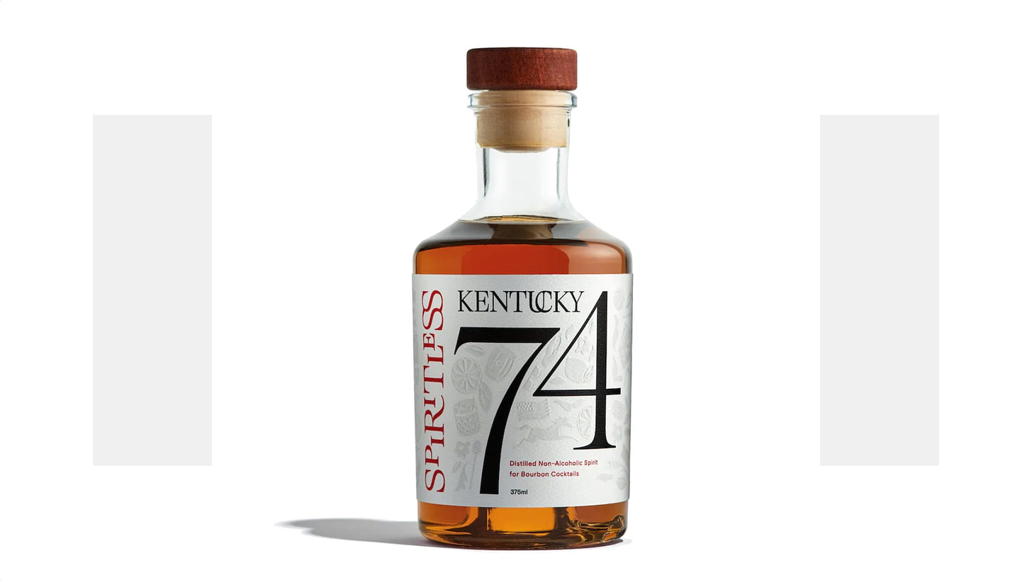 A bottle of Kentucky 74 on a white/gray background. 