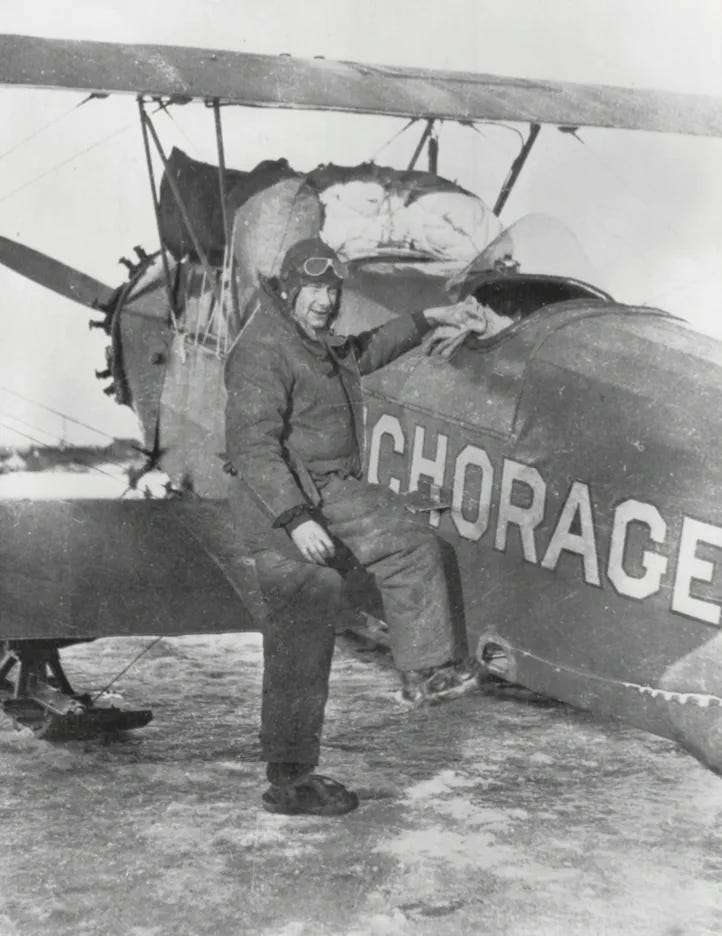 Alaska bush pilot, Russell Merrill with a load of furs.