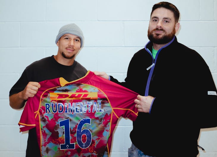 Rudimental holding a rugby shirt