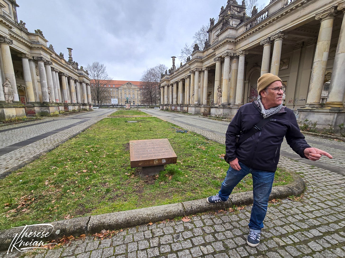Peter Graham standing in front of the Königskolonnaden during a Berlin Battle Damage tour.