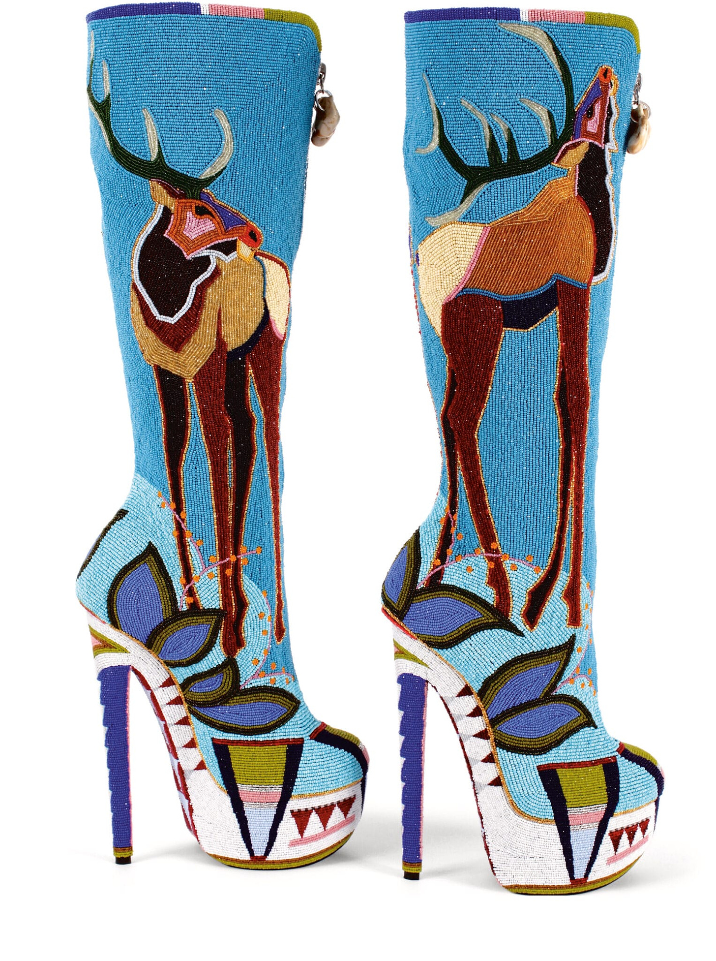 A pair of tall beaded platform heels with iamges of Elk on them, created by Jamie Okuma, an Indigenous artist.