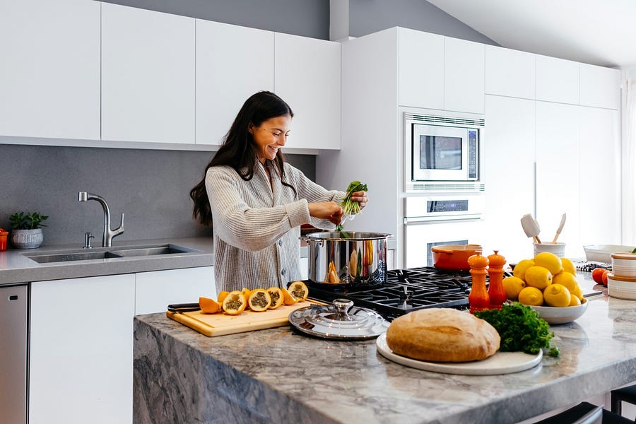 woman in kitchen cooking