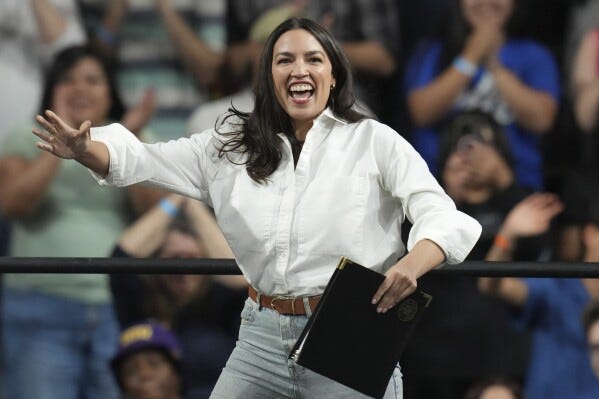AOC works to broaden appeal within a tense Democratic base | AP News