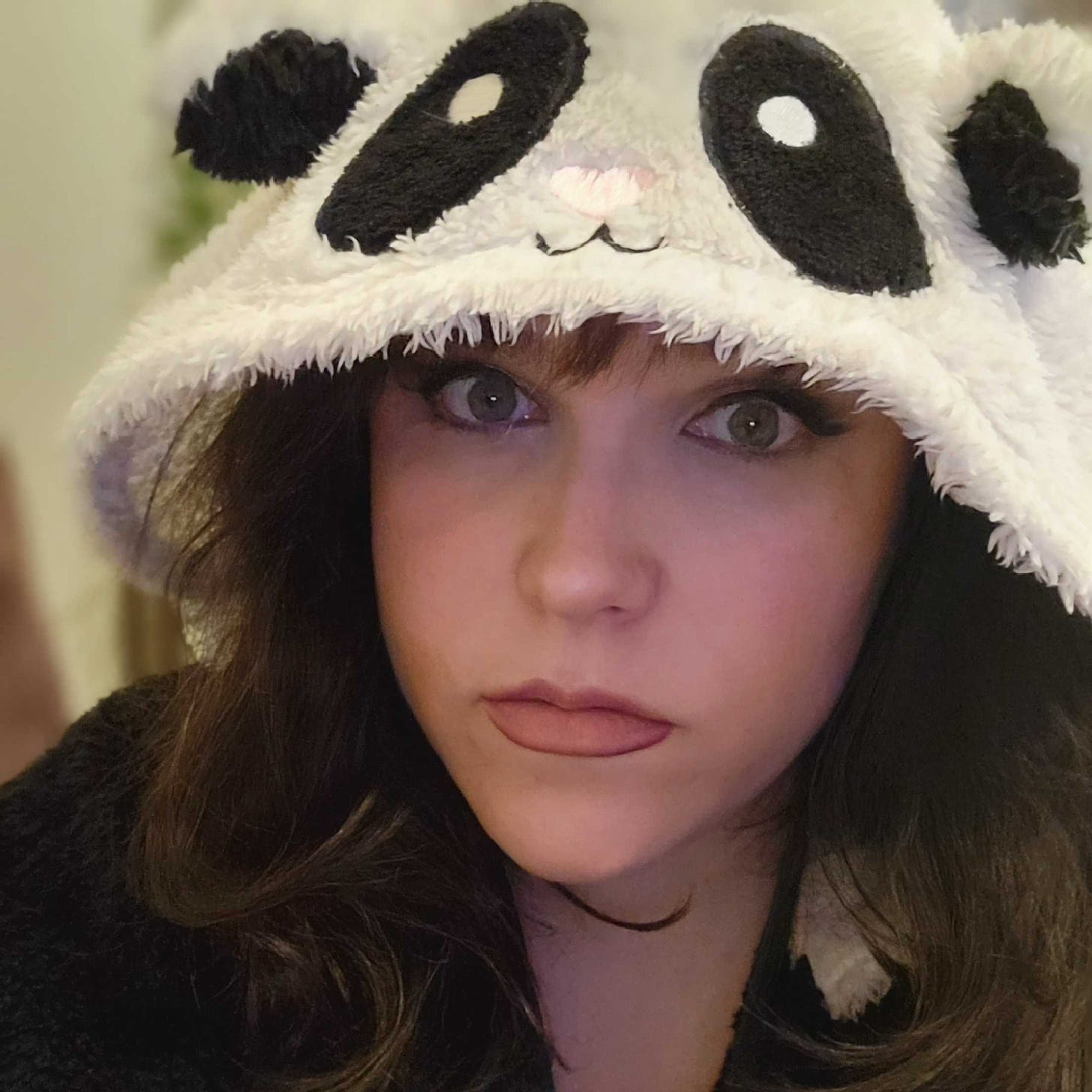 Robyn wearing a panda poncho