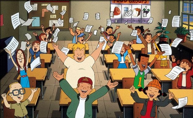 In a still from Recess: School’s Out, students throw their papers in the air, with smiles on their faces.