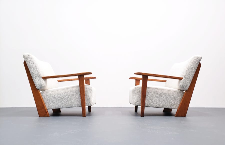 two white boule vintage chairs