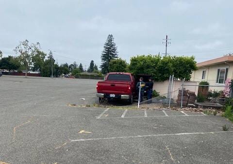This image shows Santa Rosa police investigating a collision off Brookwood Avenue Wednesday, May 31, 2023. They say a Rohnert Park man suffered a medical emergency and crashed onto property outside a vacant home. He was found hours later. (Santa Rosa Police Department)