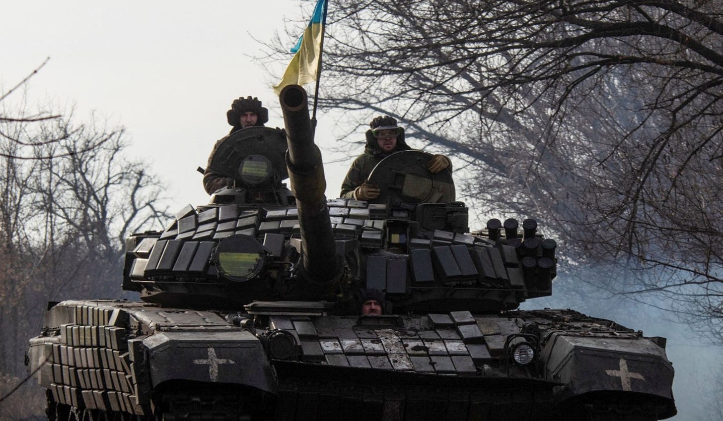 Ukrainian servicemen ride atop a tank near the frontline town of Bakhmut, Donetsk Region, Ukraine, January 20, 2023. 