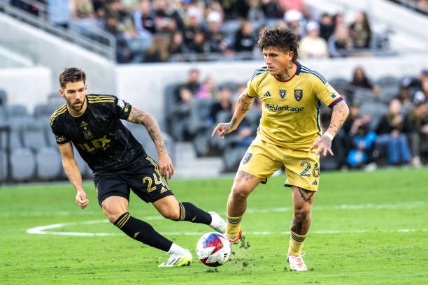 Diego Luna of Real Salt Lake battles Ryan Hollingshead of Los Angeles FC during the match at BMO Stadium on October 1, 2023 in Los Angeles,...