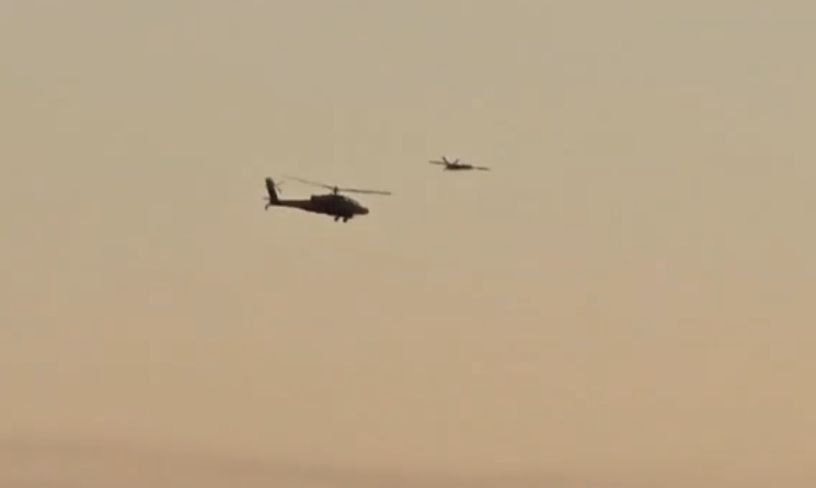 A drone from Lebanon is seen trailing an Israeli helicopter before detonating on target in Caesarea, October 19, 2024 (Social Media)